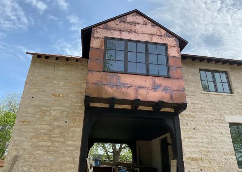 Copper metal panel facade on a stone building for Metal Roof Coating in Midway City