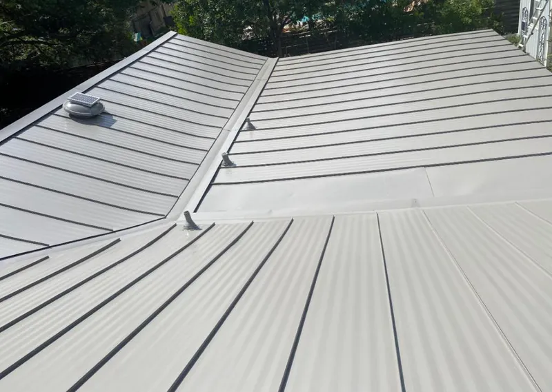 Solar attic fan installed on a metal roof for Roof Ventilation in Midway City